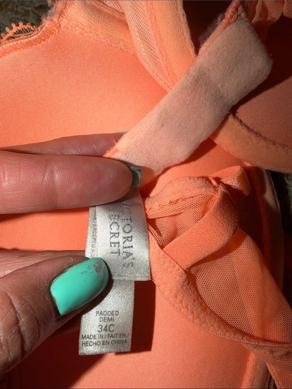 Bright orange Victoria’s Secret “Padded Demi” bra
